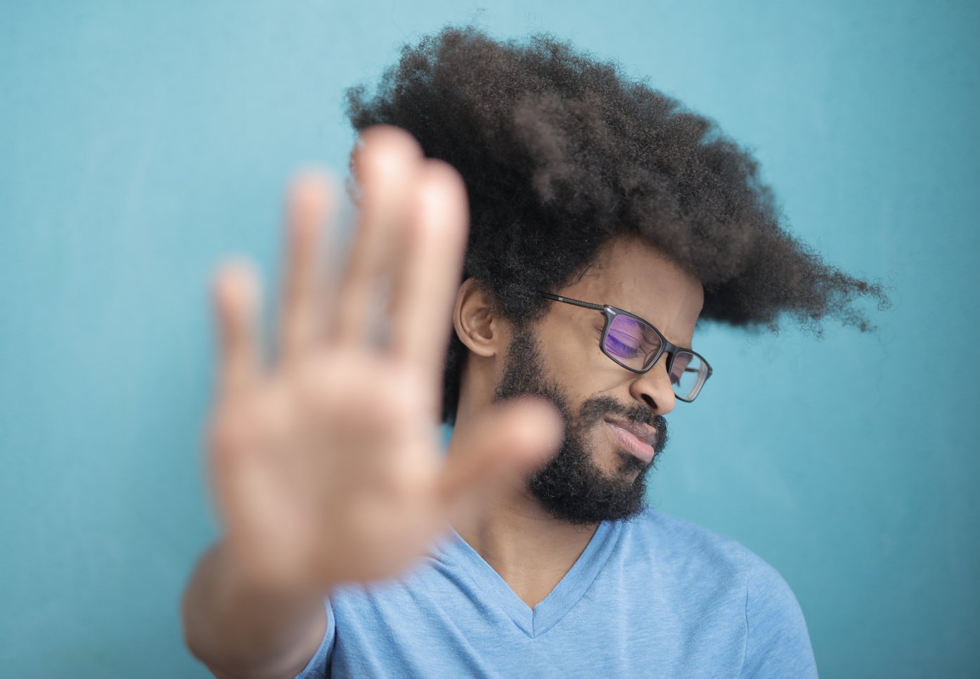 Man in Blue Crew Neck Shirt Wearing Black Framed Eyeglasses